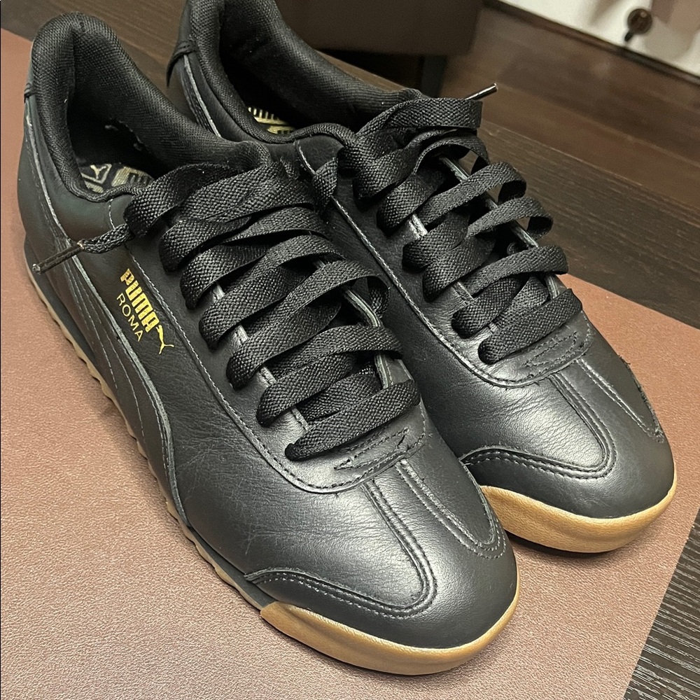 PUMA Men's Black Sneakers with Gold Highlights